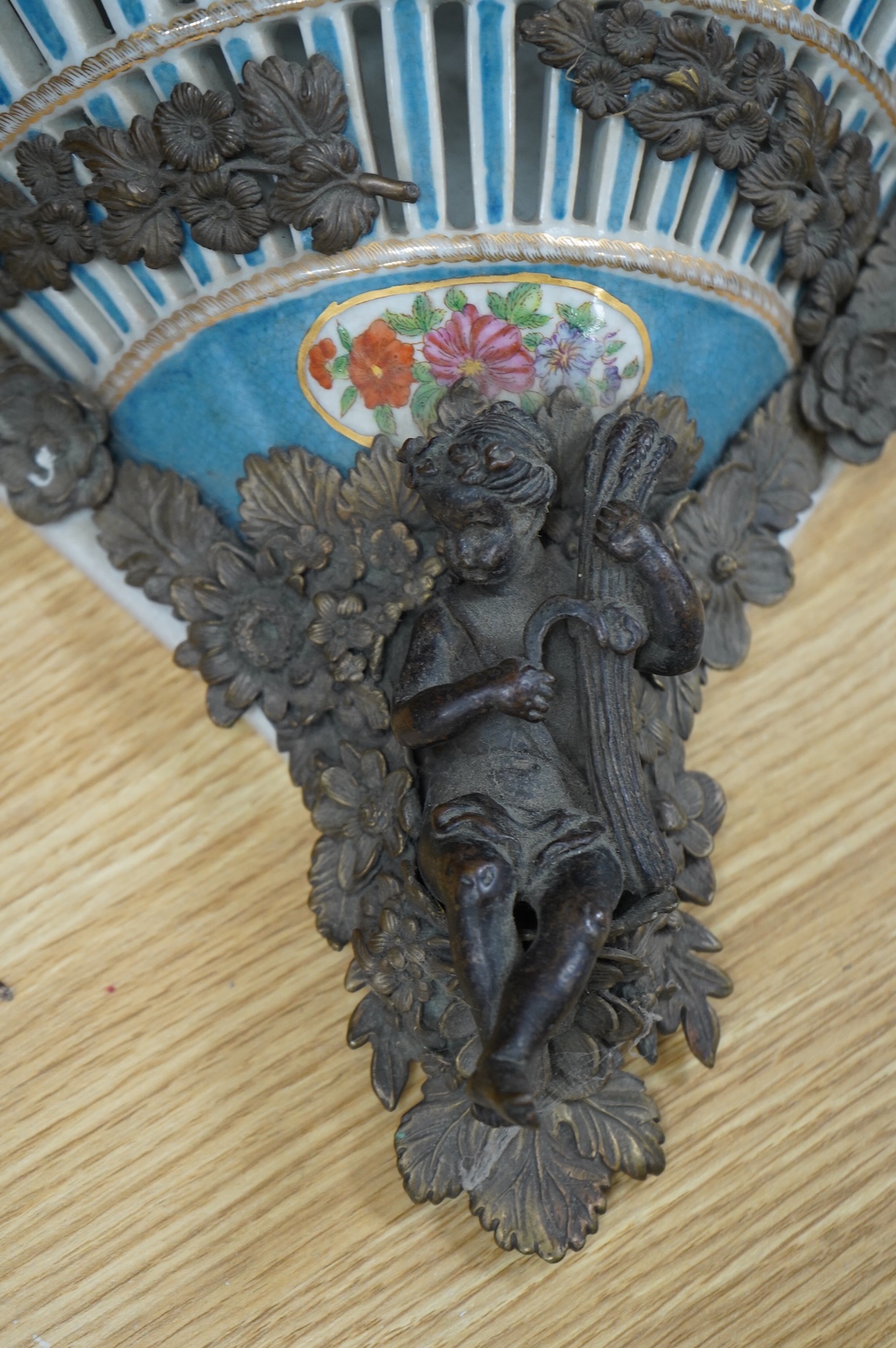 A pair of Sevres style pierced ceramic brackets with bronze mounts, 26 x 31cm